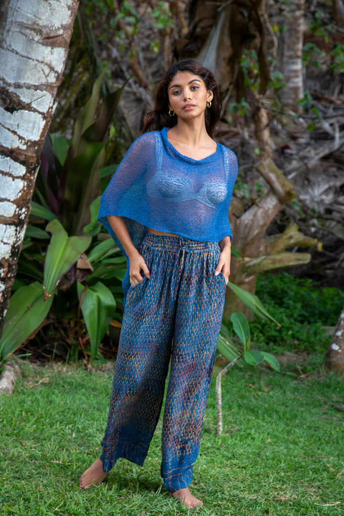 Woman standing upclose wearing Blue #126 Knit Poncho Shawl