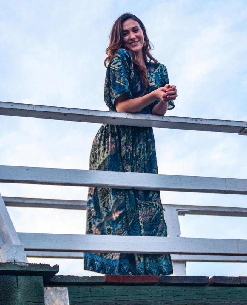 Woman wearing Bali Prema Amy Kimono Dress in Navy Leaf