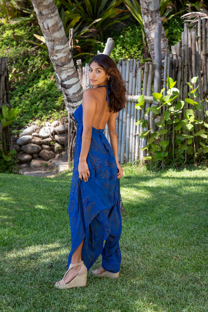 Woman wearing Gypsy Jumpsuit in Bora Bora Blue Bronze Palm