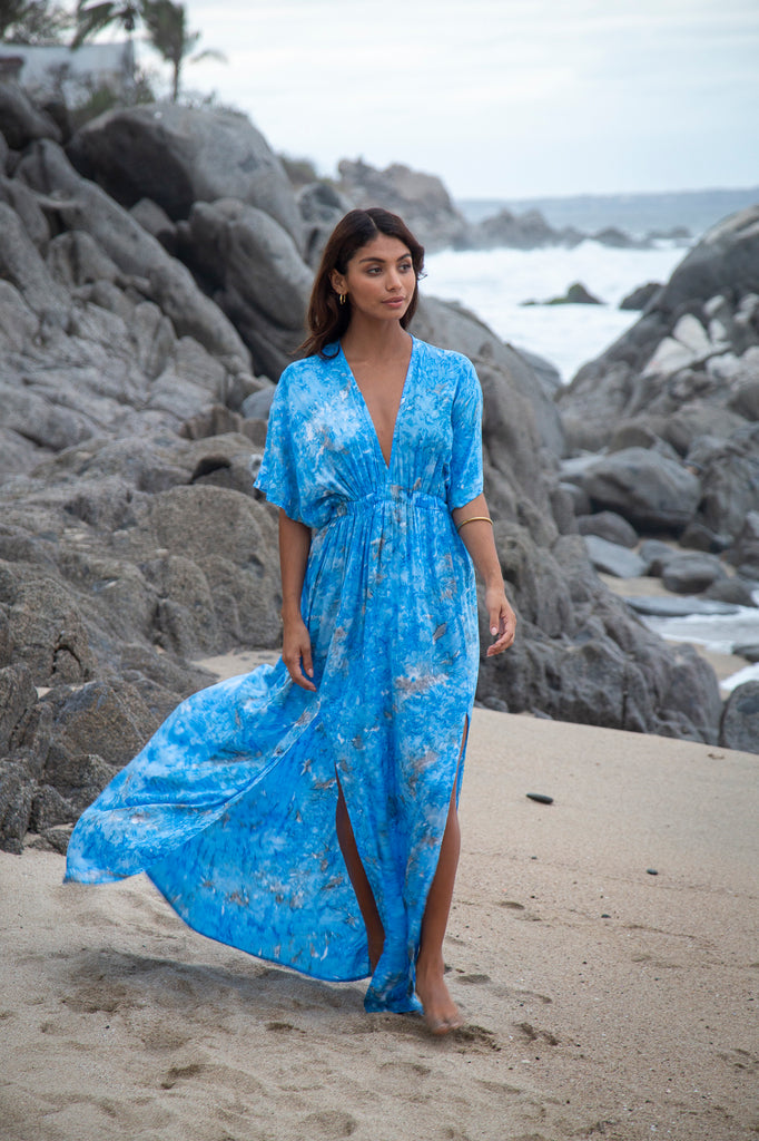 Front of a woman wearing Amy Kimono Maxi Summer Dress - Liz Taylor Blue Watercolor on a beach.