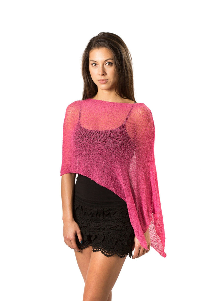 Woman wearing pink sheer knit lightweight poncho shawl wrap for resort, wedding, beach, nursing, travel, events, over black outfit and white background