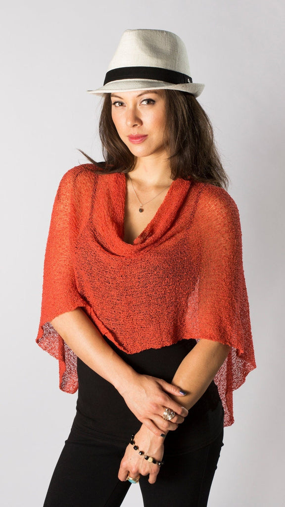 Woman standing upclose wearing Tangerine Orange #111 Knit Poncho Shawl